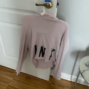 light hoodie with “x’s” on the sleeves